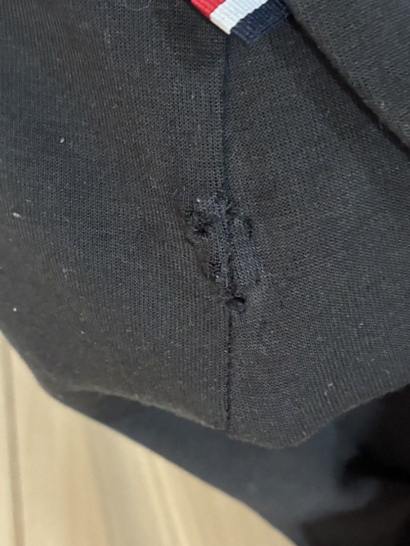Tommy Hilfiger Black Hoodie - Size M (Category: Hoodies) located in Makati City. Submitted by lps.ph (Listing ID 1434447876, Image 3). Description: Issue - May hole sa side .