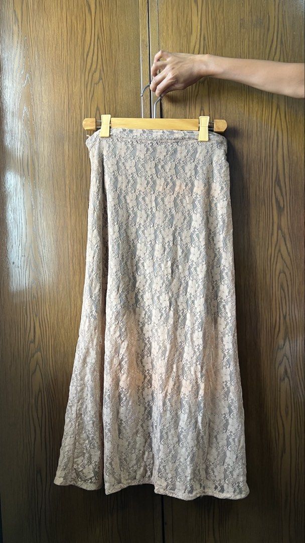 Unarosa Lace Skirt (Category: Skirts) located in Manila. Submitted by jovyannlim (Listing ID 1434472778, Image 3). Description: Elegant Unarosa lace skirt in a neutral color. Features a button-down front and a flattering A-line silhouette. Size M Perfect for both casual and semi-formal occasions. Lace detailing.