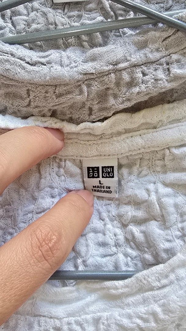 Uniqlo Shirt - Size L (Category: Shirts) located in Manila. Submitted by nikitaclaire (Listing ID 1434474537, Image 2). Description: - Uniqlo shirt (Size L) - Made in Thailand - Light color - Textured fabric - Includes Uniqlo size tag.