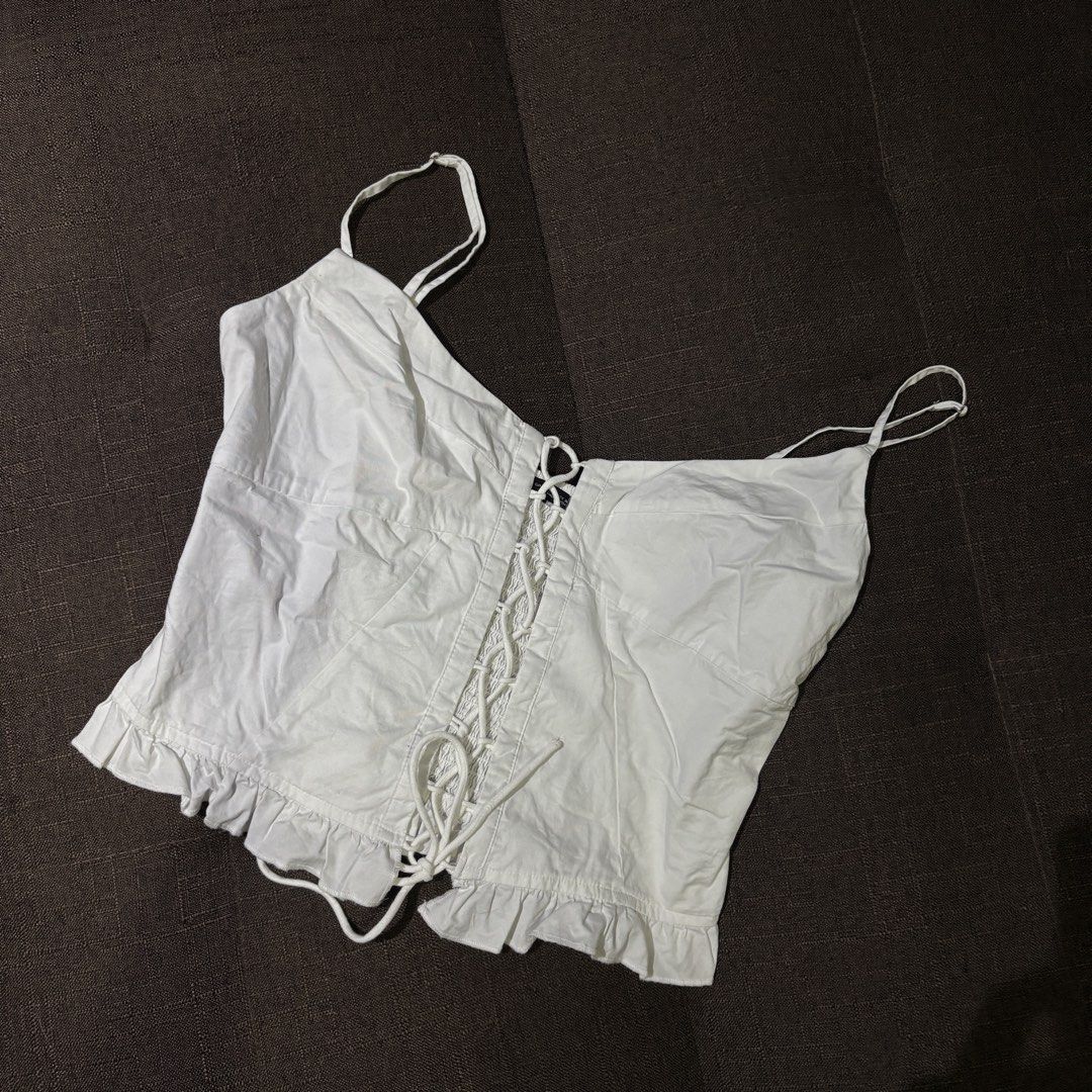 Zara Lace-up Smocked Cami Top (Category: Sleeveless) located in Cebu City. Submitted by thegoodcatchceb (Listing ID 1434560774, Image 1). Description: Zara White Lace-Up Smocked Corset Top (Size L) Condition: 10/10 (Worn once. Best fits Medium to Large frames due to the stretchy back.).