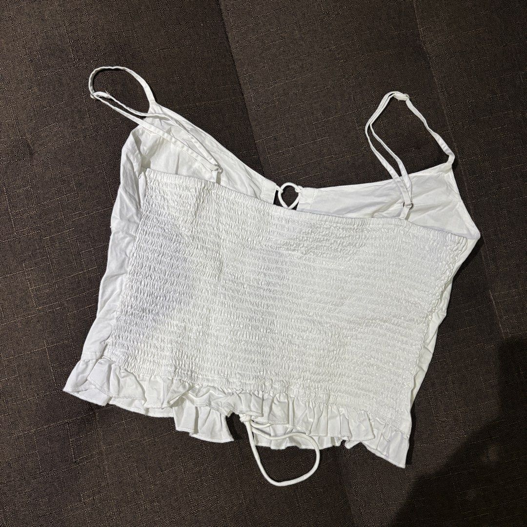 Zara Lace-up Smocked Cami Top (Category: Sleeveless) located in Cebu City. Submitted by thegoodcatchceb (Listing ID 1434560774, Image 2). Description: Zara White Lace-Up Smocked Corset Top (Size L) Condition: 10/10 (Worn once. Best fits Medium to Large frames due to the stretchy back.).