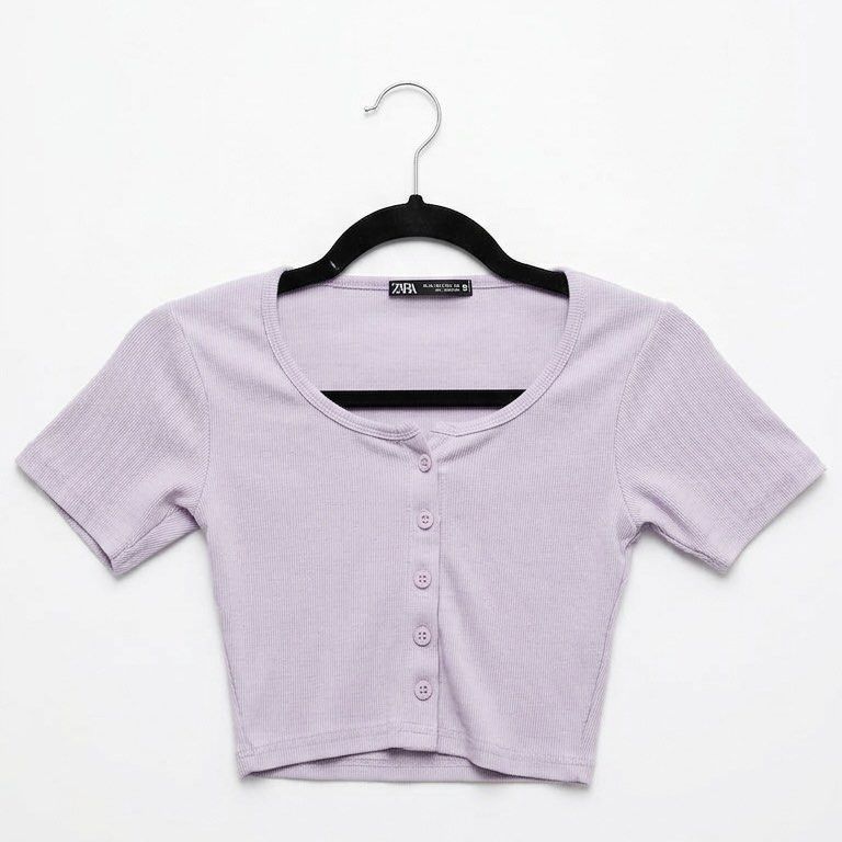 Zara XS-S Lilac Knitted Top (Category: Blouses) located in Dasmarinas. Submitted by domilleee__ (Listing ID 1434438258, Image 2). Description: - Zara cropped top - Lilac color - Made of stretchy, knitted fabric - Button-down front - Short sleeves - Available size: XS-S - Perfect for high-waisted bottoms.