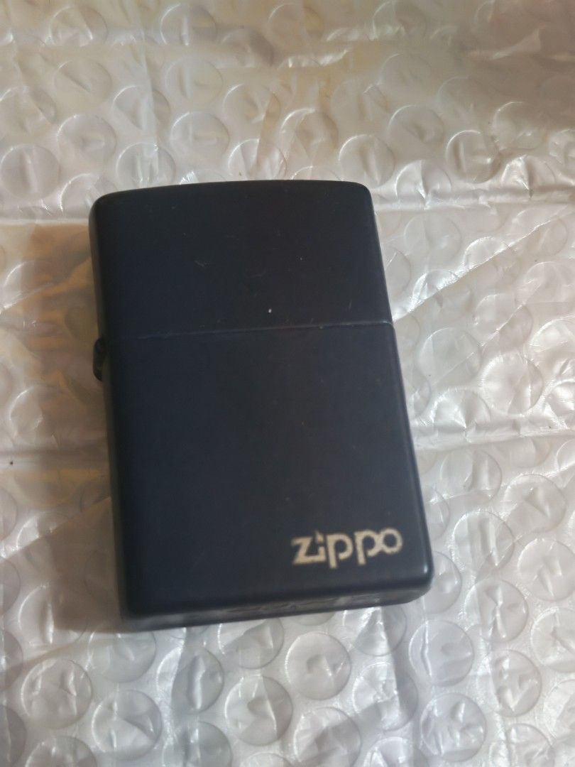 Zippo Black Lighter (Category: Vintage Collectibles) located in Manila. Submitted by GentleGiant (Listing ID 1434567627, Image 1). Description: - Black Zippo lighter - Features the Zippo logo - Classic design - Ideal for collectors or daily use - Reliable and stylish accessory.