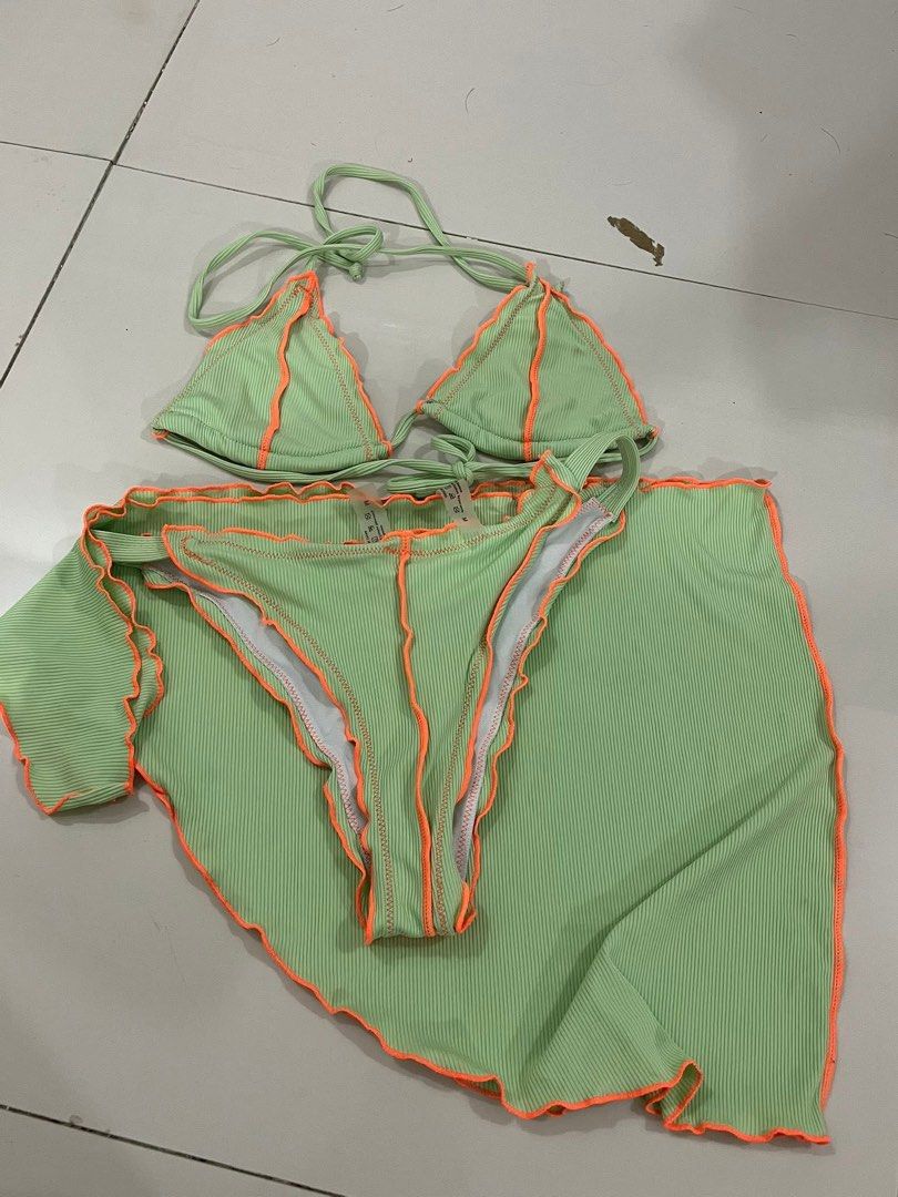3n1 Green Bikini Set with Orange Trim (Category: Bikinis & Swimsuits) located in Trece Martires City. Submitted by rubyjwle (Listing ID 1434734828, Image 1). Description: - Light green bikini set with orange trim - 3n1 Includes triangle top, bikini bottom, and matching skirt -Never used -Top has no pads (but has holes for pads) .