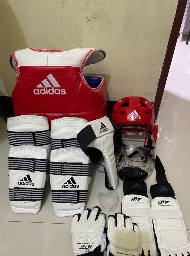 Adidas Taekwondo Gear Set (Category: Other Sports Equipment and Supplies) located in Manila. Submitted by dreiiiuu (Listing ID 1434805229, Image 1). Description: - Complete Adidas Taekwondo gear set. - Includes: - Chest protector - Headgear - Face shield - Hand protectors - Foot protectors - Shin guards - Groin protector - All items shown in images. - Perfect for training and competition..