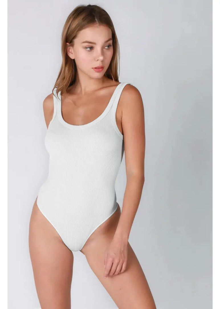 BNWOT Zara White Ribbed Bodysuit (Category: Others Tops) located in Malolos. Submitted by dofugin (Listing ID 1434792664, Image 2). Description: - White ribbed bodysuit - Scoop neckline - High-cut leg - Sleeveless design - Stretchy material - Solid color - Suitable for various occasions.