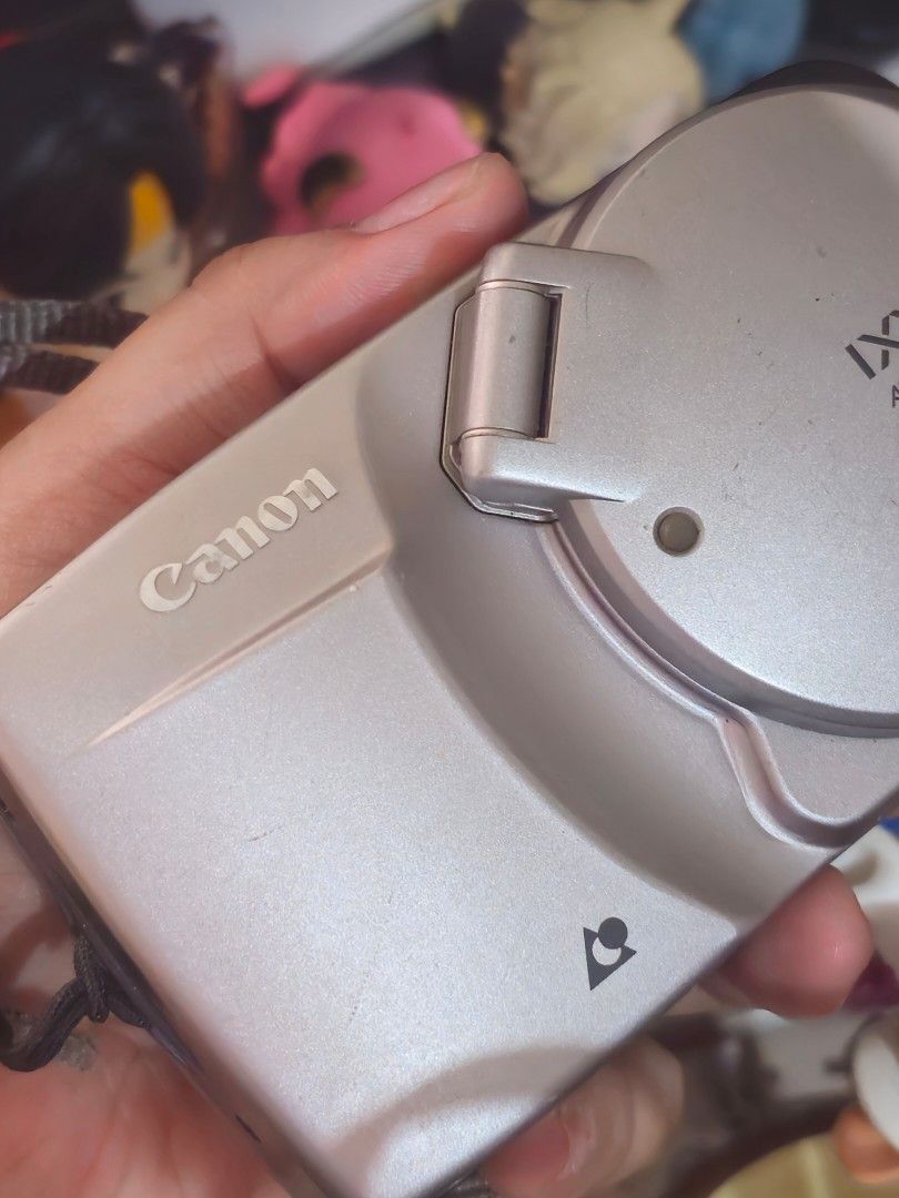 Canon IXY Digital Camera (Category: Cameras) located in Quezon City. Submitted by ame_1234 (Listing ID 1434666884, Image 3). Description: - Canon IXY digital camera - Silver color - Includes lens cover - Comes with strap attachment - Sleek, compact design Untested. As is. Possible not working.