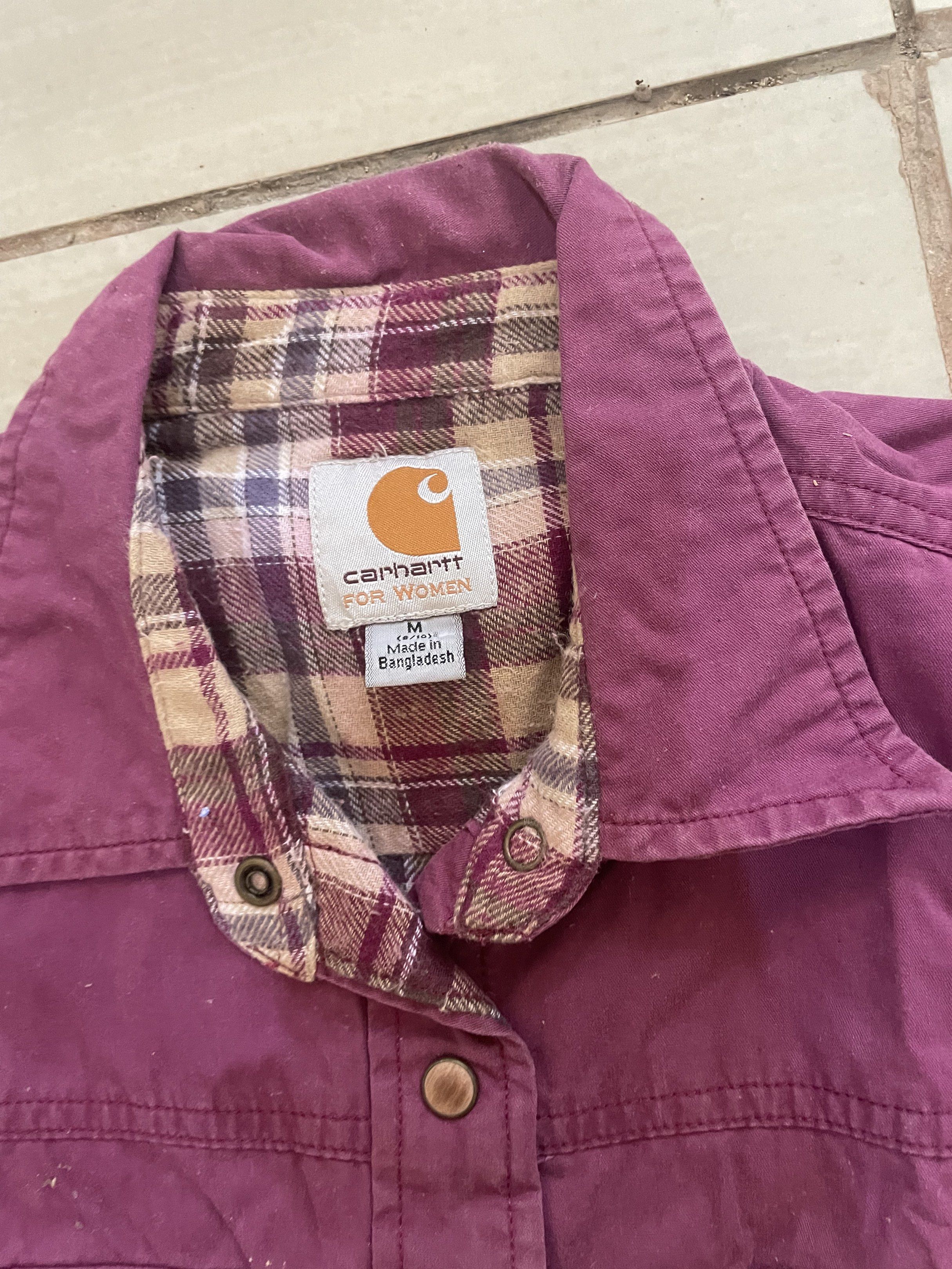 Carhartt For Women Shirt (Category: Shirts) located in Santa Barbara. Submitted by frryt (Listing ID 1434603292, Image 3). Description: - Carhartt women's button-down shirt - Features two chest pockets - Stylish plaid lining on collar and inside - Deep purple color - Size: Medium - Made in Bangladesh.