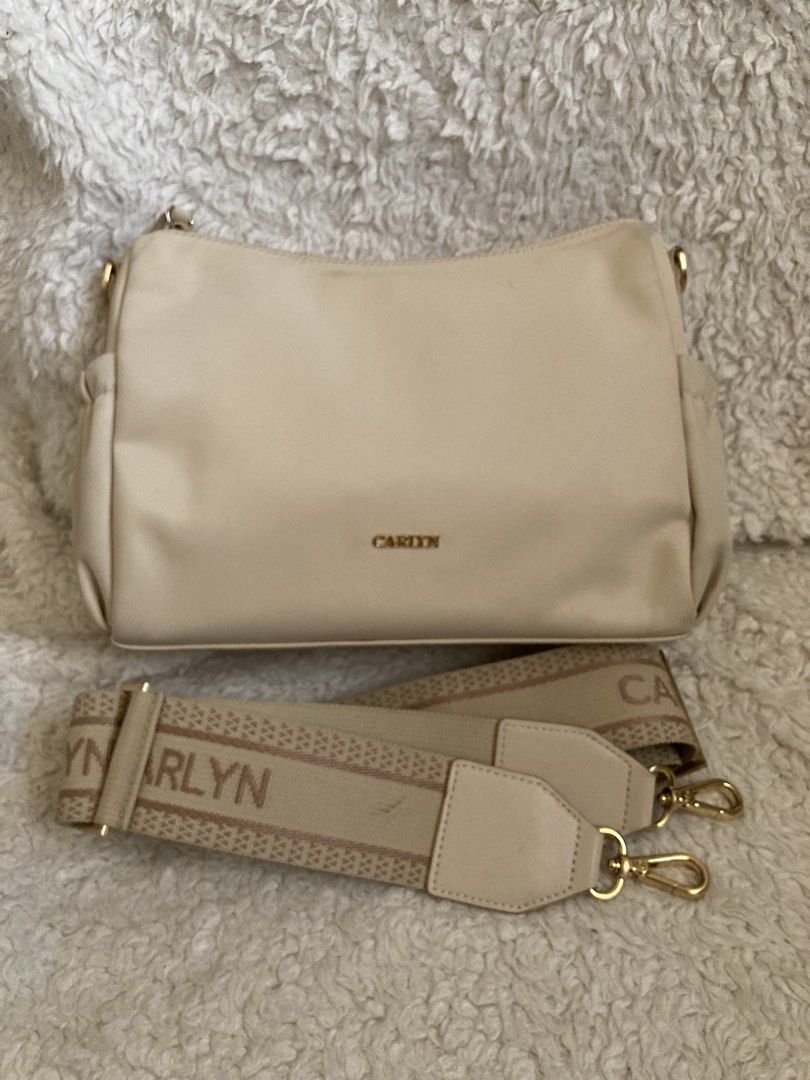 Carlyn Draw - Nylon crossbody (Ivory) (Category: Cross-body Bags) located in Mabalacat. Submitted by bagstrend (Listing ID 1434609163, Image 1). Description: Minimal dirt near zipper line and side garters of the outer pocket Dimension: 9.5" L x 7" H Color: Ivory Very good condition No COD, payment via gcash or bpi bank transfer. Price + sf Courier: JRS express / LBC No reservations. Pay today, ship tomorrow. No ship out on Sundays. Preloved, plea