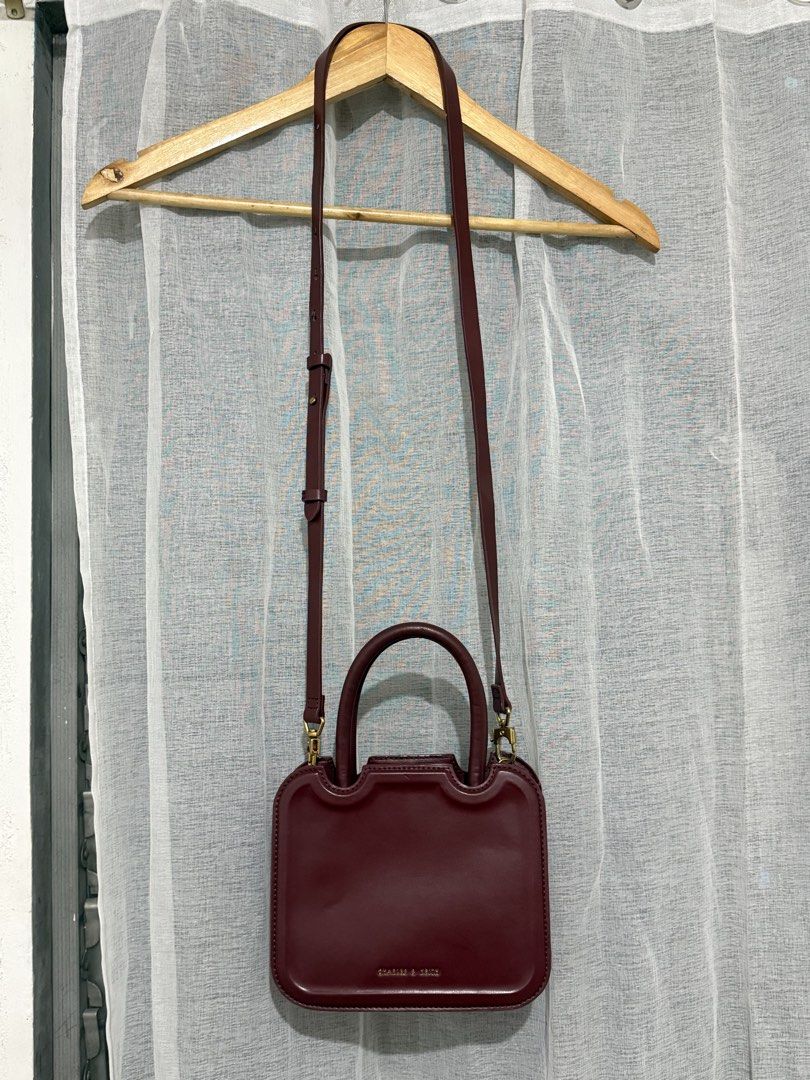 CHARLES & KEITH BURGUNDY SLING BAG (Category: Luxury Bags & Wallets) located in Manila. Submitted by zfinds- (Listing ID 1434773109, Image 2). Description: C&K sling bag burgundy preloved but like new . no issue price negotiable .