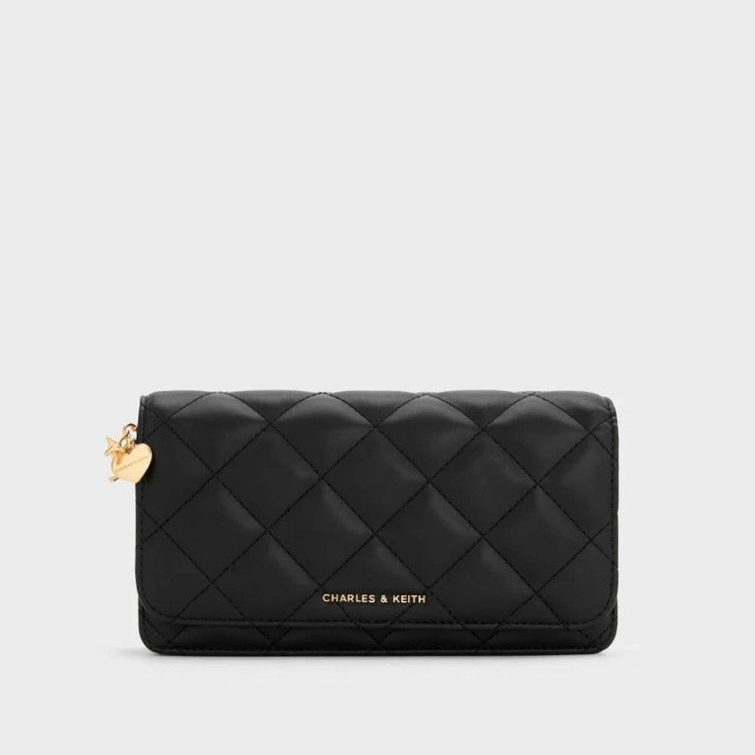 Charles & Keith Quilted Wallet With Chain Sling (Category: Wallets & Card holders) located in Pasig City. Submitted by ff.ph (Listing ID 1434651750, Image 1). Description: Sling Wallet With Box With Card slots With zipper compartment Color Black Add paperbag plus 80.