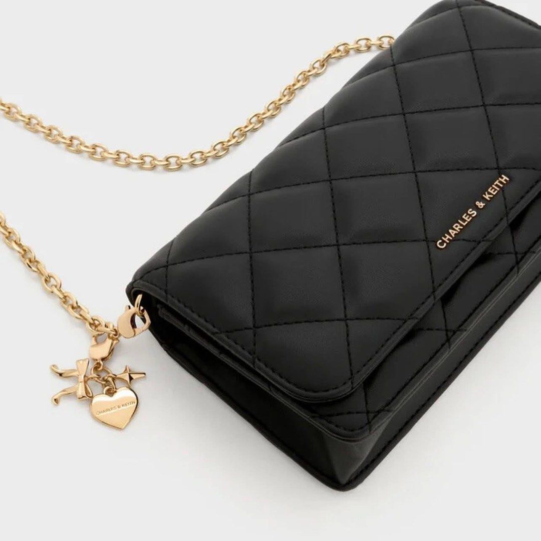 Charles & Keith Quilted Wallet With Chain Sling (Category: Wallets & Card holders) located in Pasig City. Submitted by ff.ph (Listing ID 1434651750, Image 3). Description: Sling Wallet With Box With Card slots With zipper compartment Color Black Add paperbag plus 80.