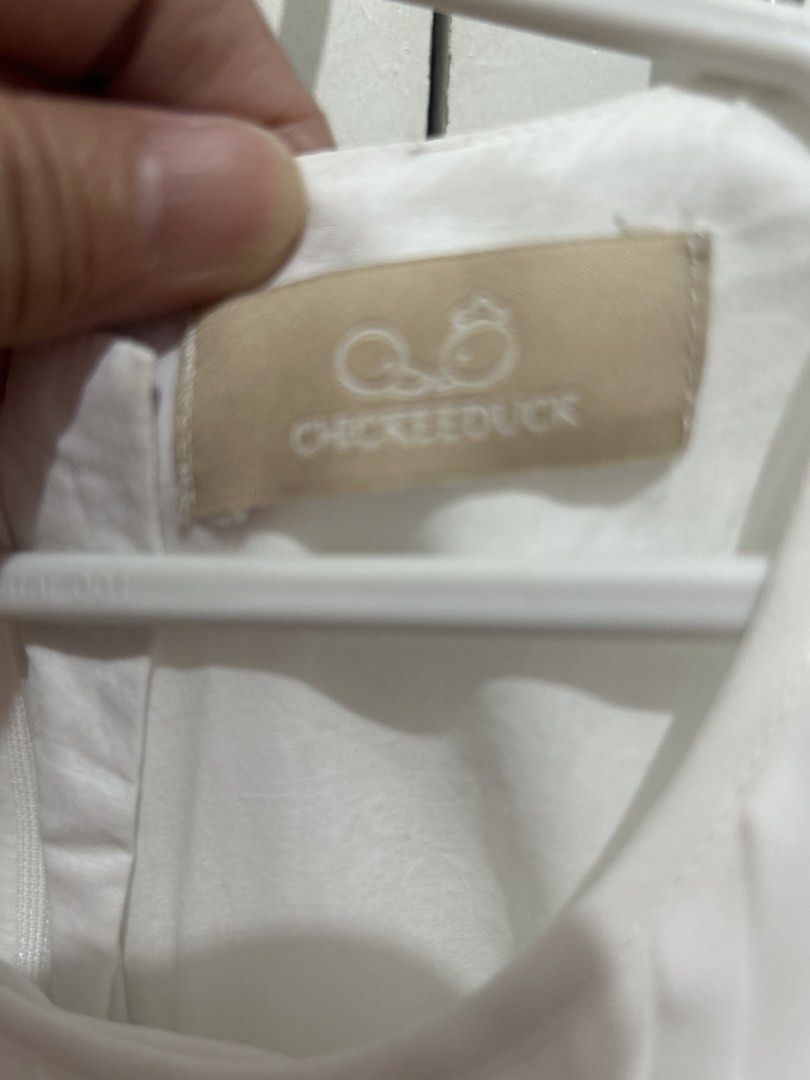 Chic Kee Duck White Pleated Dress (Category: Babies & Kids Fashion) located in Manila. Submitted by primemover2 (Listing ID 1434706582, Image 2). Description: - Chic Kee Duck white dress - Pleated design - Ruffle details on sleeves and hem - Round neckline - Zipper closure at the back - Lightweight fabric - Suitable for warm weather - Great for casual or special occasions.