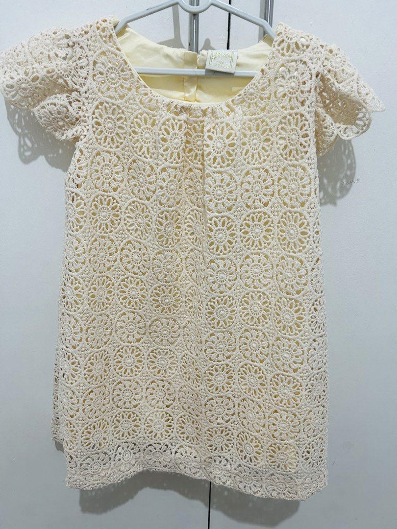 Cream Crochet Dress (Category: Babies & Kids Fashion) located in Manila. Submitted by primemover2 (Listing ID 1434701624, Image 1). Description: - Cream-colored dress - Delicate crochet overlay with floral pattern - Short sleeves - Round neckline - Light yellow lining - Made in China - Shell: 100% nylon - Lining: 100% polyester.