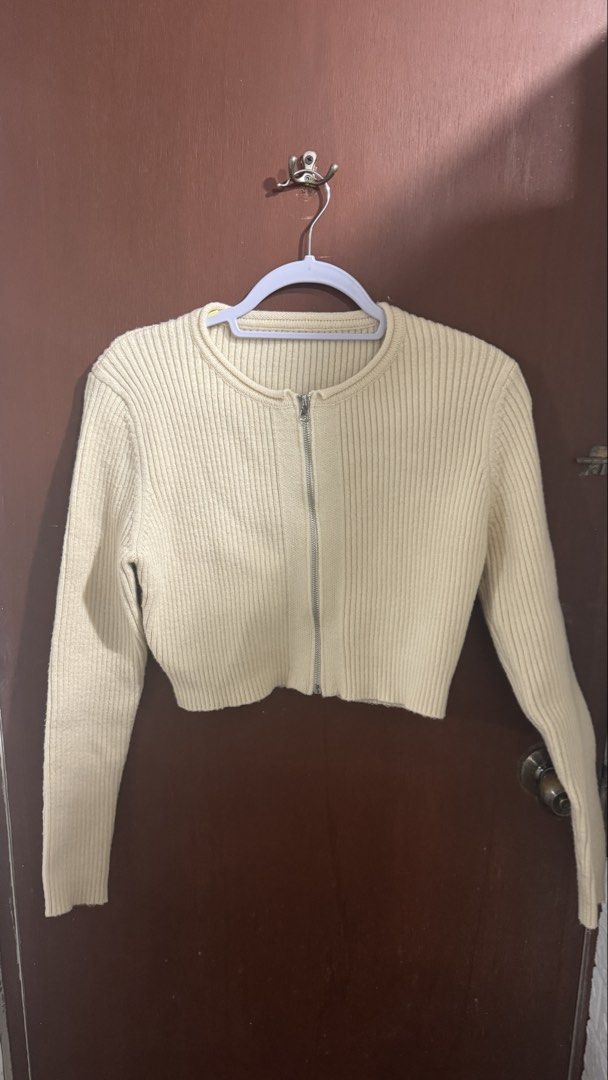 Cream Ribbed Crop Cardigan (Category: Longsleeves) located in Paranaque City. Submitted by migvee (Listing ID 1434760961, Image 3). Description: - Cream/pale yellow ribbed crop cardigan - Zip-up closure - Long sleeves - Round neckline - Cropped style - Versatile for layering Fits XS-S. Viscose cotton material. Long sleeves, good for layering <33.
