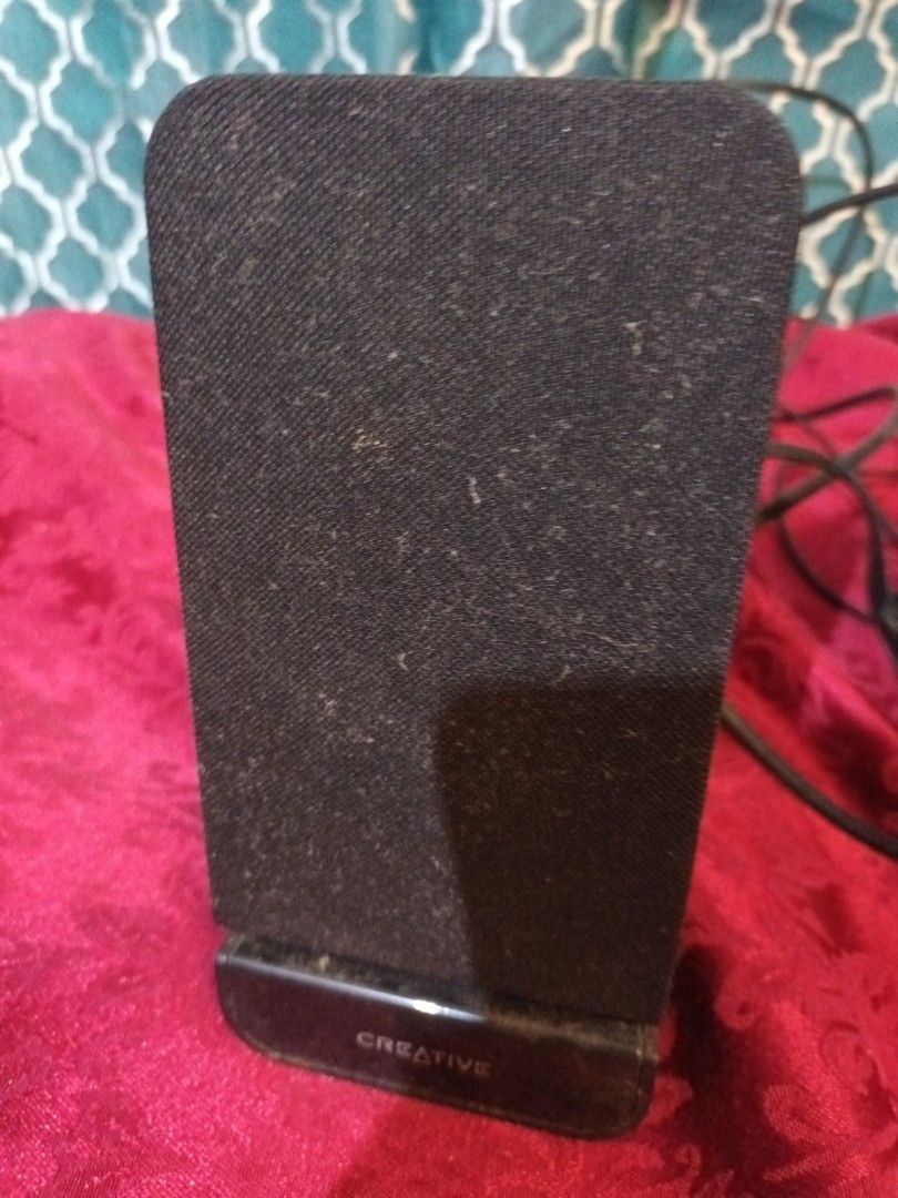 Creative A60 Speakers (Not Tested) (Category: Soundbars, Speakers & Amplifiers) located in Makati City. Submitted by epic_prelovedmakati (Listing ID 1434629498, Image 3). Description: - Creative A60 speakers - Sleek black design - Includes two speakers - Comes with connecting wires - Rectangular shape with mesh front - Designed for flat surfaces.