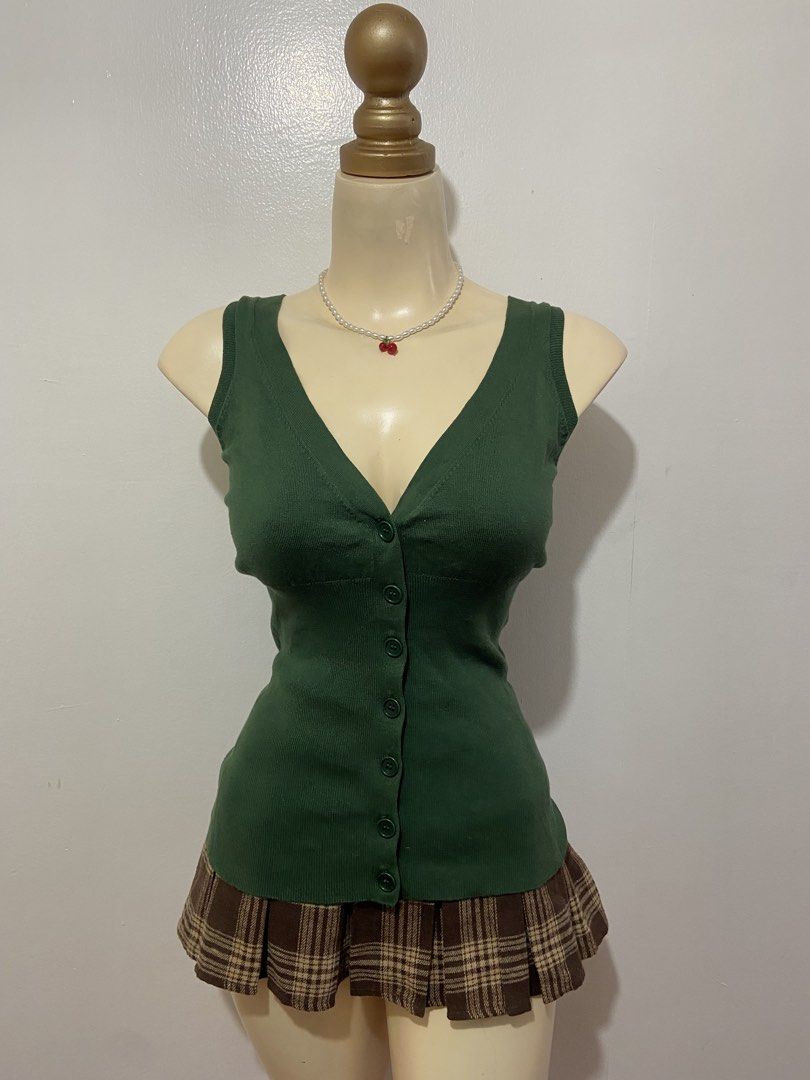 Dark Green Sweater Vest Top (Category: Sleeveless) located in Mandaluyong City. Submitted by cxia_style (Listing ID 1434781945, Image 1). Description: Top Only‼️ ♡ washed & ready-to-wear ♡ all items are handpicked ♡ nationwide shipping ♡ see each photo for more details. DM us for more info 💌.