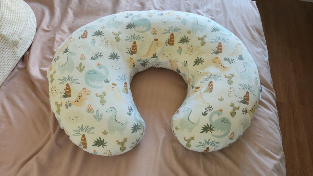 Dinosaur Print Nursing Pillow (Category: Maternity Care) located in Manila. Submitted by llcd_declutters (Listing ID 1434705709, Image 2). Description: - Dinosaur-themed nursing pillow. - Designed for comfortable breastfeeding support. - Features a curved shape for optimal positioning. - Made with soft fabric. - Adorable design with dinosaurs and cacti..