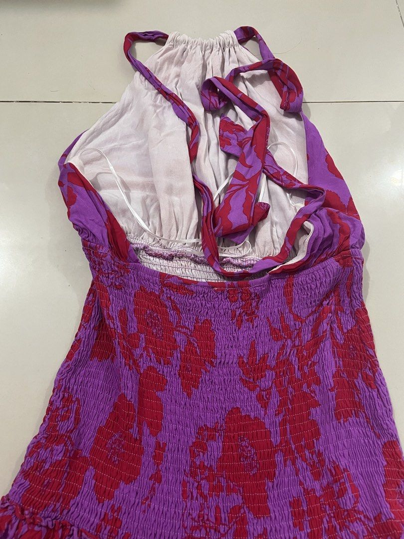 Floral Halter Dress for summer (Category: Dresses) located in Trece Martires City. Submitted by rubyjwle (Listing ID 1434734034, Image 2). Description: -Never used - Mini dress with vibrant purple and red floral print - Halter neckline - Smocked bodice - Tiered ruffle hemline - Open back with tie closure Price is negotiable! 🪷Mode of payment: 💙Payment First thru GCash 🪷Mode of delivery: ❤️Direct J&T express .