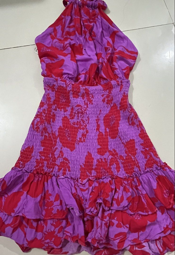 Floral Halter Dress for summer (Category: Dresses) located in Trece Martires City. Submitted by rubyjwle (Listing ID 1434734034, Image 1). Description: -Never used - Mini dress with vibrant purple and red floral print - Halter neckline - Smocked bodice - Tiered ruffle hemline - Open back with tie closure Price is negotiable! 🪷Mode of payment: 💙Payment First thru GCash 🪷Mode of delivery: ❤️Direct J&T express .