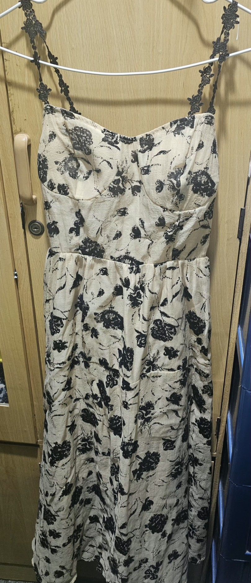 Floral Print Dress (Category: Dresses) located in Quezon City. Submitted by paulyn02 (Listing ID 1434668495, Image 1). Description: - Beige dress with a black floral print. - Features a halter neck design. - Delicate lace detailing on the straps. - Midi length..