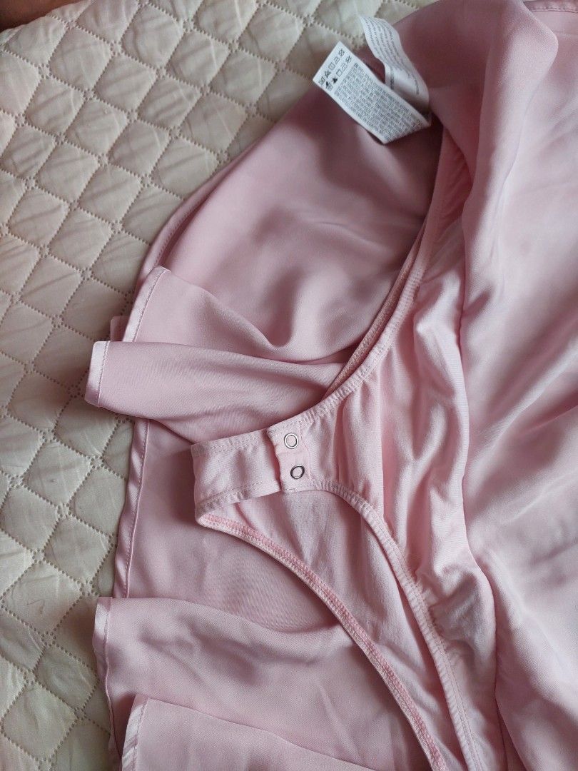 Forever 21 Pink Satin Skirt (Category: Skirts) located in Cainta. Submitted by q_preloved_items (Listing ID 1434634088, Image 2). Description: - Forever 21 pink satin wrap skirt - Features button details - Includes a built-in bodysuit - Ruffled hemline - Waist: Approximately 14 inches across - never used, nalabhan lang at naalis na ang tag - super nice at nakaka sexy but this ia not style anymore. .