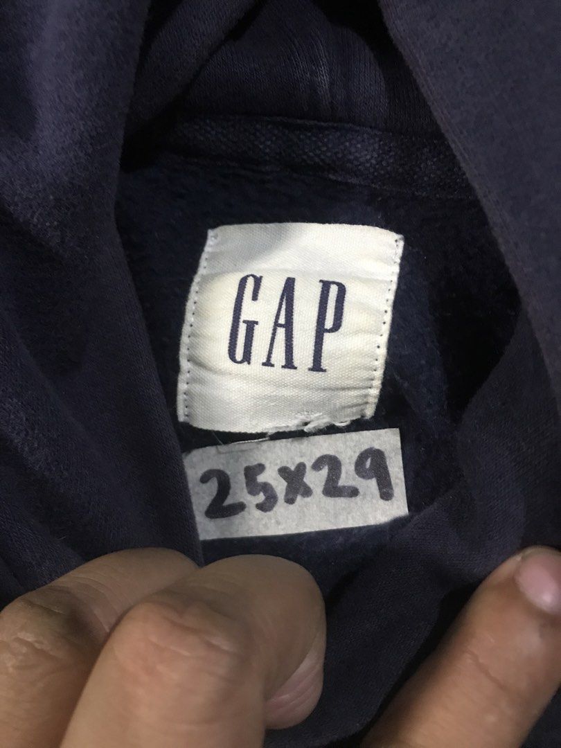 GAP Athletic Hoodie (Category: Hoodies) located in Manila. Submitted by zerimar01 (Listing ID 1434802622, Image 3). Description: Navy blue GAP hoodie with "ATHLETIC" printed on the front and "CALIFORNIA" on the back. Features a kangaroo pocket. Made in Vietnam. Size is XL. 25x29 Dimensions Fabric composition: 77% cotton, 23% polyester..