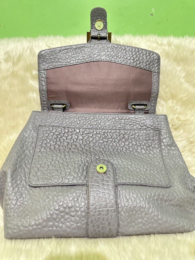 GEORGES RECH CROC LEATHER BAG (Category: Luxury Bags & Wallets) located in Angeles City. Submitted by chicprelovedstuffs.owl (Listing ID 1434679178, Image 2). Description: FREE SHIPPING‼️‼️ Preloved Bag‼️ MINE now, ship the next day‼️ RFS: Decluttering / No space for new bags - Gray Croc leather handbag w/ sling strap - Flap closure with gold-tone buckle - Top handle and detachable shoulder strap - Interior: zippered pocket and multiple compartme