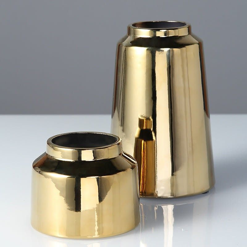 Golden Ceramic Vase Home Decor Decorative Display (Category: Vases & Decorative Bowls) located in Taguig. Submitted by mommyph2023 (Listing ID 1434734840, Image 1). Description: - Where metallic brilliance meets modern design. - The perfect pair to elevate your decor. - Sleek, shiny, and simply stunning. - A touch of luxury for your home. - Golden glow 🪙 - Perfect decor pieces. -made of ceramic - 2 sizes available Short and Tall short - Php 570 