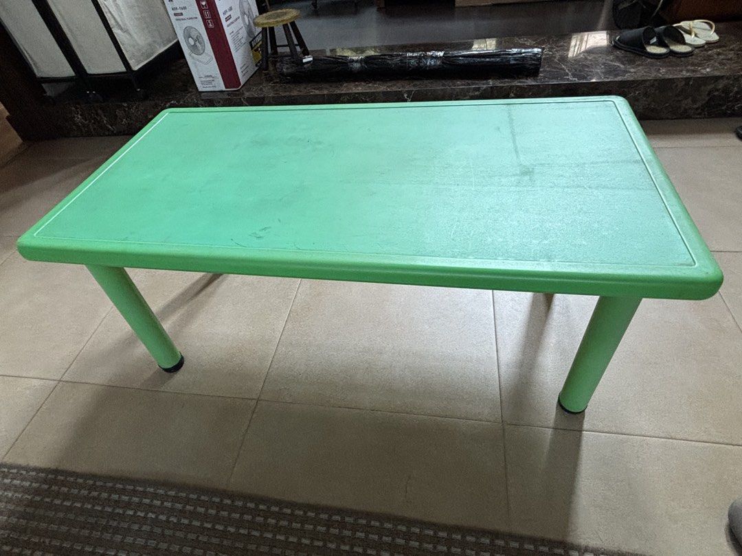 Green Plastic Table (Category: Tables & Sets) located in San Juan City. Submitted by kitsugi (Listing ID 1434716822, Image 1). Description: - Rectangular green plastic table - Simple and sturdy design - Versatile use: study table or small dining table - Practical and functional furniture.