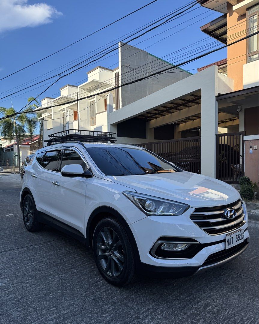 Hyundai Santa Fe 2.4 GLS (A) (Category: Used Cars) located in Paranaque City. Submitted by jrucars (Listing ID 1434730157, Image 3). Description: 2017 Hyundai Santa Fe Automatic transmission 7 seater All power Dual airbag Climate control aircon Steering controls Cruise control Android head unit w/ local channels Reverse sensor with camera Roof rack 4 new tires Nlex/Slex rfid installed Price:₱648,000 Accepts trade-in and financing Opt 1 (low month