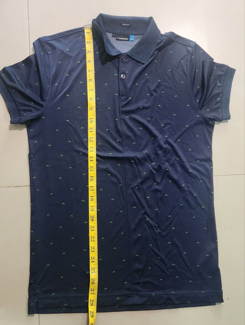 j.lindeberg Regular Fit Polo Shirt (Category: Tshirts & Polo Shirts ) located in Paranaque City. Submitted by 606wuwtrading (Listing ID 1434671179, Image 3). Description: FIX PRICE!! MOP : GCASH OR GOTYME Shipping : Lalamove or Gogo Express shouldered by buyer - J.Lindeberg polo shirt - Color: Navy blue - Size: S - Fit: Regular - Material: 100% polyester - Features: Collared neckline, short sleeves, subtle pattern - Made in Taiwan.