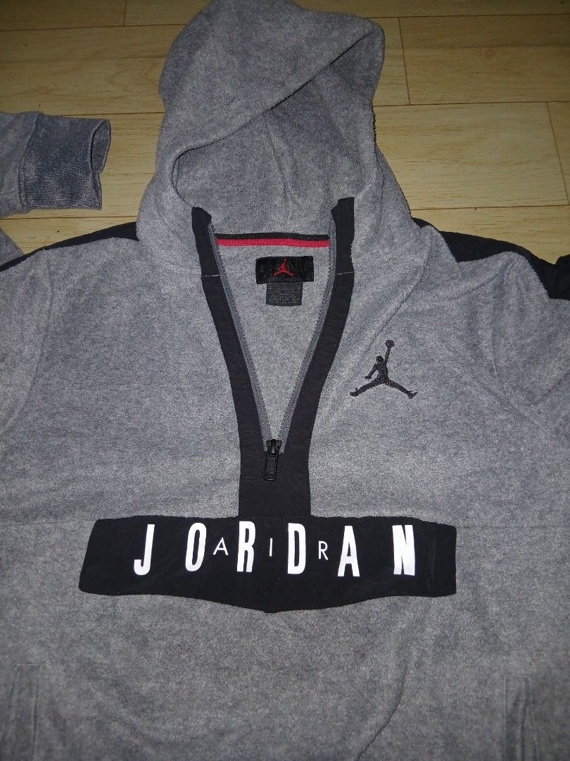 Jordan Hoodie with Zipper (Category: Coats, Jackets and Outerwear) located in General Santos City (Dadiangas). Submitted by afsph1996 (Listing ID 1433614383, Image 3). Description: - Gray Jordan hoodie - Zipper closure - Jordan logo on chest - "JORDAN" printed across front - Hooded - Black accents on sleeves - Made of polyester and other materials - Size tag included Youth 13-15 Yrs old -small adult .