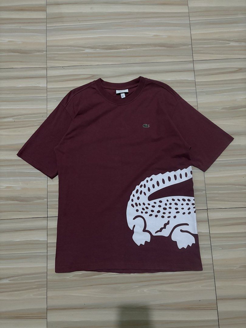 Lacoste Biglogo Maroon T-shirt (Category: Tshirts & Polo Shirts ) located in Ajuy. Submitted by reeyn0515 (Listing ID 1434786956, Image 2). Description: - Authentic Lacoste Biglogo T-shirt - Color: Maroon - Size: L - Features large white crocodile graphic on front and back - Crew neck design - Lacoste logo on chest.