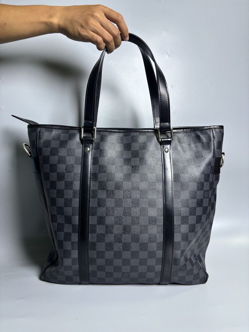 Louis Vuitton Damier Graphite Tote Bag (Category: Luxury Bags & Wallets) located in Manila. Submitted by manisanro47672 (Listing ID 1434806006, Image 3). Description: - Authentic Louis Vuitton Damier Graphite Tote Bag - Classic checkered design - Spacious interior - Dual top handles and detachable shoulder strap - Secure zip closure - Silver-tone hardware - Suitable for casual and business use.