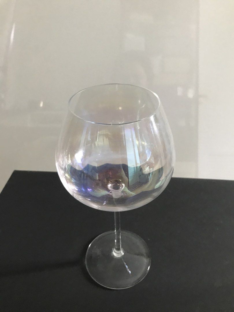 LSA Iridescent Wine Glass (Category: Dinnerware & Cutlery) located in Quezon City. Submitted by draxxfinds (Listing ID 1434701537, Image 1). Description: - Iridescent finish wine glass - Features a rounded bowl and slender stem - Clear, smooth surface - Wide base for stability - Comfortable grip - Ideal for wine and other beverages - Stylish addition to your home bar.