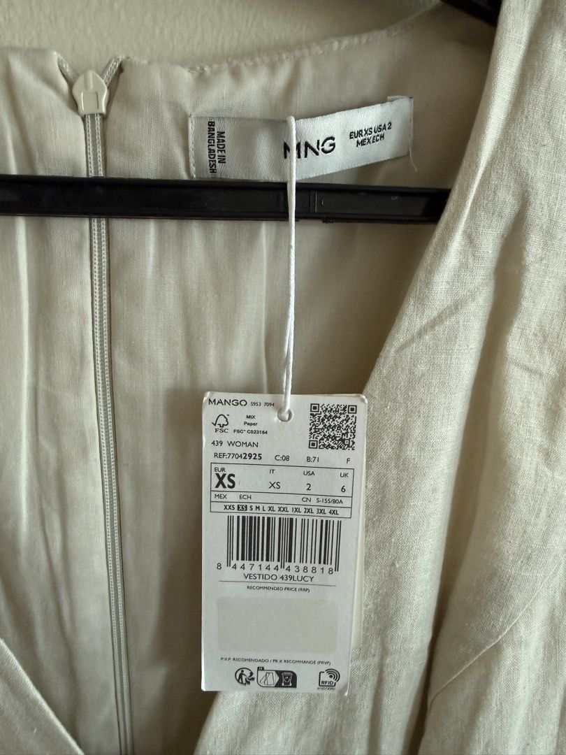 Mango Linen Mini Dress - XS (Category: Dresses) located in Makati City. Submitted by clothesilovedx (Listing ID 1434613657, Image 3). Description: - Mango mini dress - Color: Beige - Size: XS - V-neckline with tie detail - Sleeveless - Fabric: Linen - Back zipper closure - Suitable for casual and semi-formal events.
