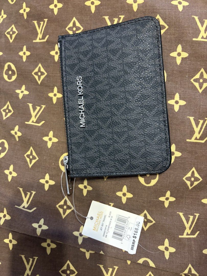 Michael Kors Jet Set Travel Card Case (Category: Wallets & Card holders) located in Makati City. Submitted by sm0302 (Listing ID 1434673057, Image 1). Description: - Michael Kors card case - Jet Set Travel design - Black color - Zip closure - Multiple card slots - Includes original price tag - Compact and stylish.