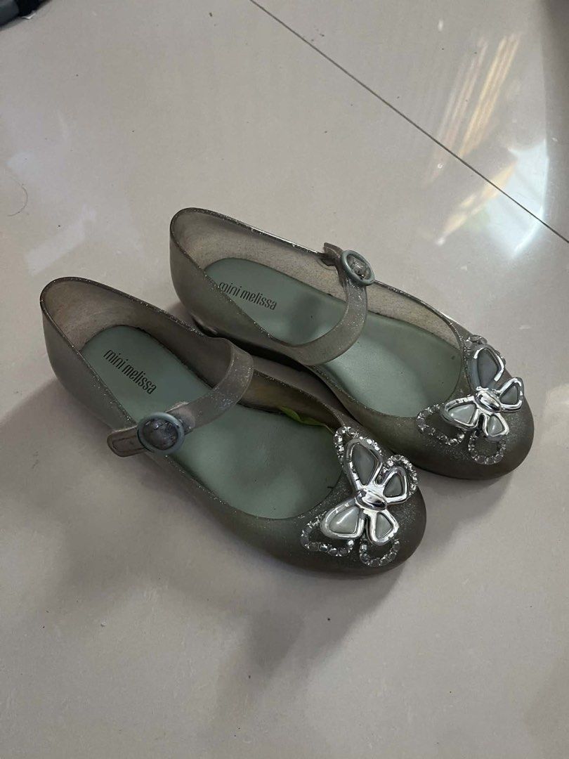 Mini Melissa Ballerina Shoes (Category: Babies & Kids Fashion) located in Binan City. Submitted by rainbowdash30 (Listing ID 1434725350, Image 3). Description: - Mini Melissa jelly shoes (Sweet Love Fly ballerina) - Butterfly embellishments - Silver glitter finish - Buckle closure - Mini Melissa logo on insole Size: US12 RFS: Decluttering kids’ stuff Brand new price is at P2,895 Selling at just P799.