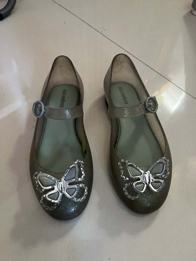 Mini Melissa Ballerina Shoes (Category: Babies & Kids Fashion) located in Binan City. Submitted by rainbowdash30 (Listing ID 1434725350, Image 2). Description: - Mini Melissa jelly shoes (Sweet Love Fly ballerina) - Butterfly embellishments - Silver glitter finish - Buckle closure - Mini Melissa logo on insole Size: US12 RFS: Decluttering kids’ stuff Brand new price is at P2,895 Selling at just P799.