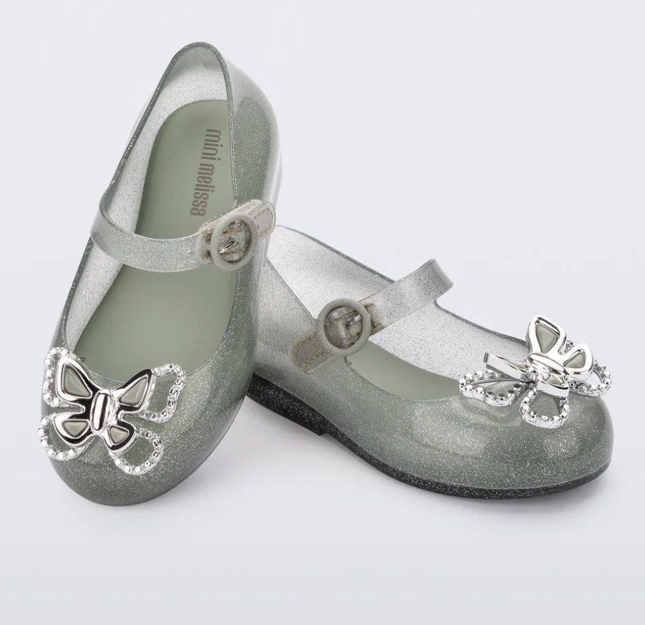 Mini Melissa Ballerina Shoes (Category: Babies & Kids Fashion) located in Binan City. Submitted by rainbowdash30 (Listing ID 1434725350, Image 1). Description: - Mini Melissa jelly shoes (Sweet Love Fly ballerina) - Butterfly embellishments - Silver glitter finish - Buckle closure - Mini Melissa logo on insole Size: US12 RFS: Decluttering kids’ stuff Brand new price is at P2,895 Selling at just P799.