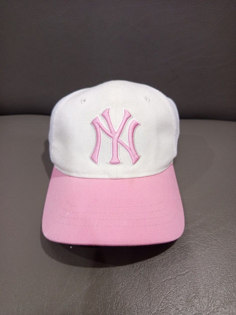 MLB New York Yankees Pink Cap (Category: Caps & Hats) located in Davao. Submitted by vaness041421 (Listing ID 1434804638, Image 1). Description: - New York Yankees cap - Pink logo on white front panel - Pink brim - Mesh back with "Yankees" detail - Adjustable strap - MLB logo on the side.
