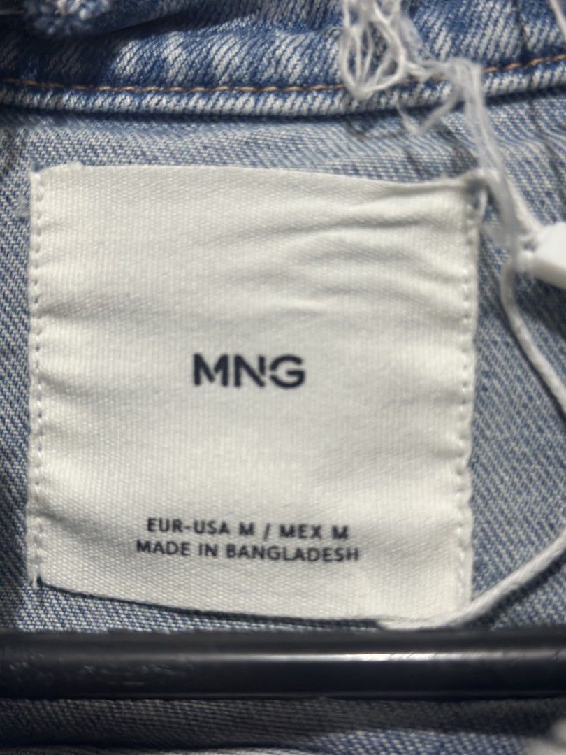 MNG Denim Jacket - Size M (Category: Coats, Jackets and Outerwear) located in Makati City. Submitted by jinritaberu (Listing ID 1434723925, Image 3). Description: Light blue denim jacket from MNG. Features a zip-up front and a cropped fit. The jacket has long sleeves and a round collar. Size M. Made in Bangladesh..