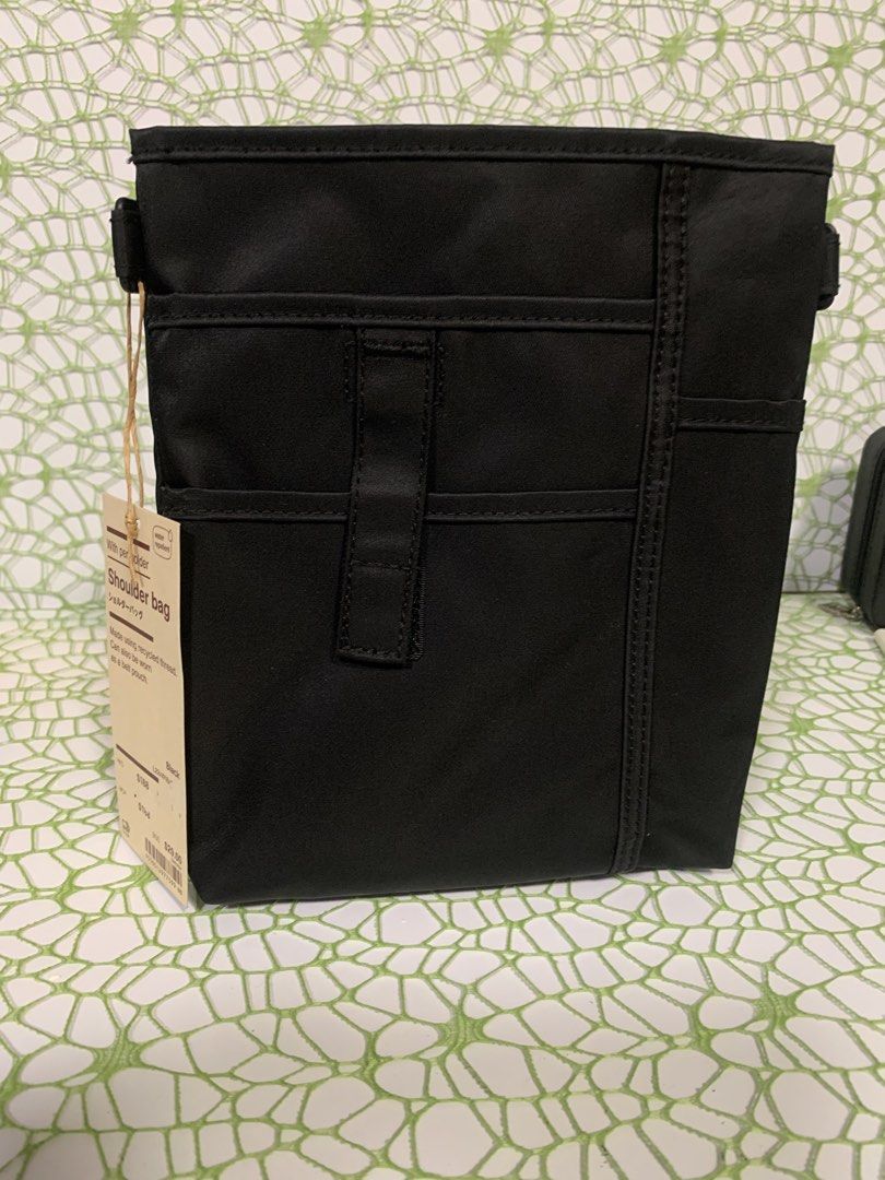 MUJI Shoulder Bag - Black (Category: Shoulder Bags) located in Mandaluyong City. Submitted by newandlovedco. (Listing ID 1434785710, Image 2). Description: - MUJI shoulder bag - Made with recycled thread - Water-repellent - Can be worn as a shoulder bag or belt pouch - Features a pen holder - Multiple pockets for organization - Zippered main compartment - Adjustable straps - Snap closure - Simple, minimalist design 📍 Location: Mandaluyong City �