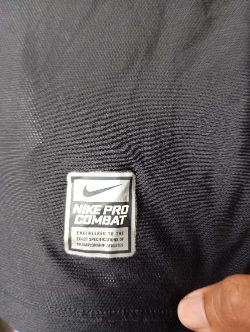 Nike Pro Combat Hypercool Compression Shirt (Category: Activewear) located in Manila. Submitted by pandahustlers (Listing ID 1434689944, Image 3). Description: - Nike Pro Combat Hypercool compression shirt - Black and gray color scheme - White stitching details - Nike logo on chest - Mesh panel on back - Size: L - Made in Indonesia.