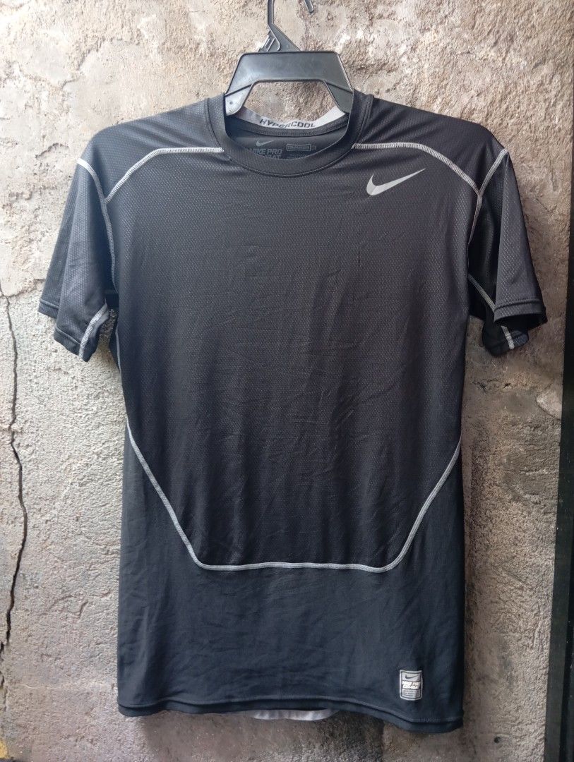 Nike Pro Combat Hypercool Compression Shirt (Category: Activewear) located in Manila. Submitted by pandahustlers (Listing ID 1434689944, Image 1). Description: - Nike Pro Combat Hypercool compression shirt - Black and gray color scheme - White stitching details - Nike logo on chest - Mesh panel on back - Size: L - Made in Indonesia.