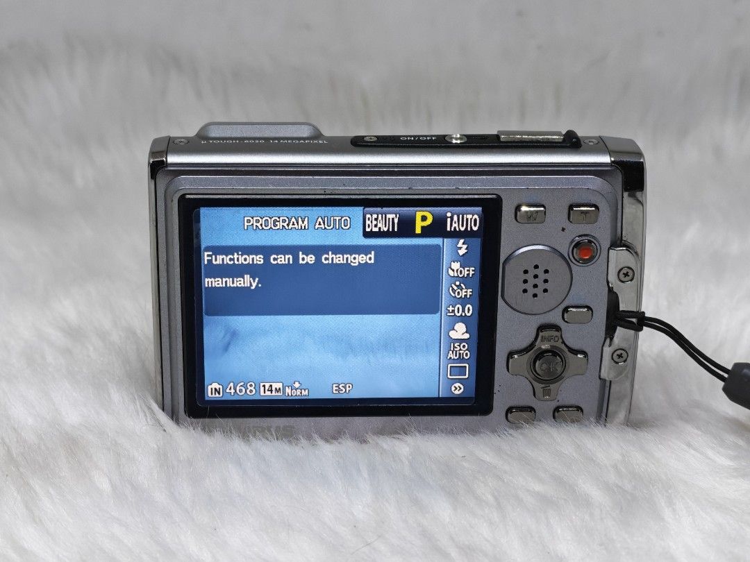 Olympus Tough-6020 14MP Digital Camera (Category: Cameras) located in Manila. Submitted by ultimogizmos (Listing ID 1434698635, Image 2). Description: - Olympus Tough-6020 digital camera - 14-megapixel sensor - Waterproof design - Stylish blue and silver color scheme - Multiple shooting modes: Program, Auto, Beauty - Easy manual function changes via screen - Simple on/off and zoom controls.