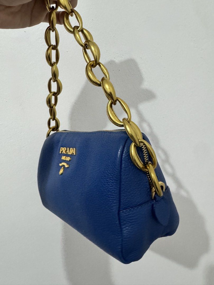 Original Prada Blue Leather Bag + Chain (Category: Luxury Bags & Wallets) located in Pasig City. Submitted by practicalpurchases (Listing ID 1434792676, Image 3). Description: - Authentic Prada handbag - Includes authenticity cards - Features Prada logo - Gold hardware - Chain added :).