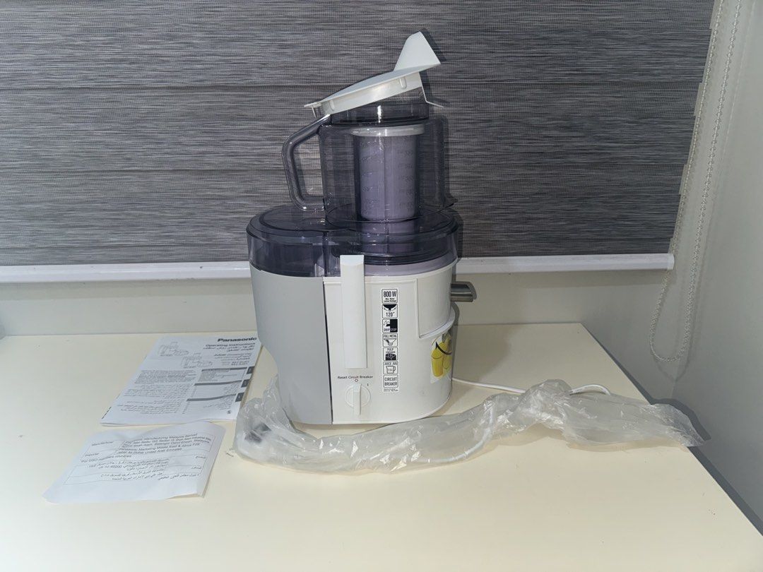 [LIKE NEW] Panasonic Juicer MJ-DJ01 (Category: Juicers, Blenders & Grinders) located in Quezon City. Submitted by _aceys (Listing ID 1434776632, Image 3). Description: - Panasonic MJ-SJ01 juicer for sale - Includes main unit, lid, and instruction manual - Original plastic wrapping on power cord - Model number: MJ-SJ01 - Color: White and gray.