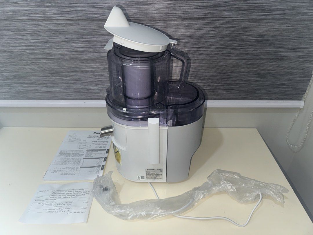 [LIKE NEW] Panasonic Juicer MJ-DJ01 (Category: Juicers, Blenders & Grinders) located in Quezon City. Submitted by _aceys (Listing ID 1434776632, Image 2). Description: - Panasonic MJ-SJ01 juicer for sale - Includes main unit, lid, and instruction manual - Original plastic wrapping on power cord - Model number: MJ-SJ01 - Color: White and gray.